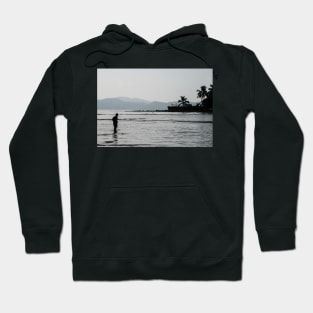 Boy walking through water in low tide Hoodie